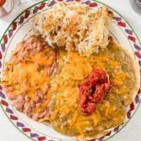 Huevos Rancheros · Three eggs on two corn tortillas smothered in our green chili, roasted salsa and cheddar che...