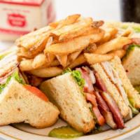 Sandys Club · Three pieces of homemade bread toasted with mayo and layers of turkey, bacon, lettuce, and t...