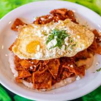 Chilaquiles Rojos ( Spycy Hot )Plz Ask For Eggs Style · The Chilaquiles are over a bed of Re-Fried Beans with 2 eggs any Style, Queso Fresco and a P...