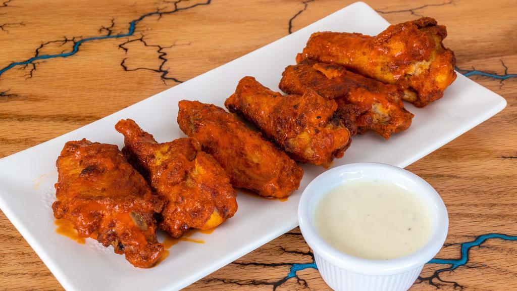 Buffalo Wood Fired Wings · Baked to perfection our wood fire buffalo wings come with your choice of ranch or blue cheese dipping sauce.