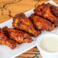 Wood Fire Wings · Baked to perfection our wood fire BBQ wings come with your choice of ranch or blue cheese di...