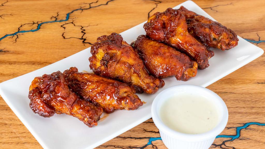 Wood Fire Wings · Baked to perfection our wood fire BBQ wings come with your choice of ranch or blue cheese dipping sauce.