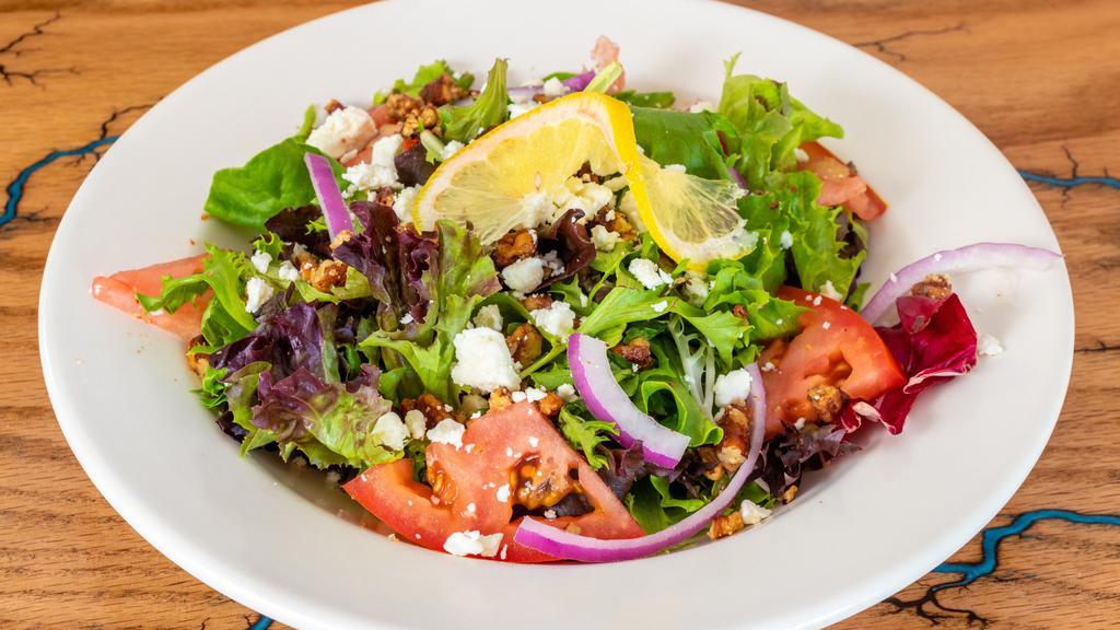 Sun Kissed Salad · Fresh spring mix, dressed in a lemon-thyme vinaigrette. Topped with red onion, cherry tomato, fresh mozzarella and candied pecans.