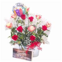 Big Celebration · Arrangement made with beautiful natural flowers.

Standard
12 roses mixed color 
with compan...
