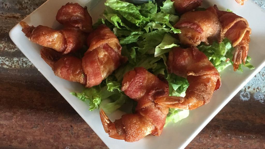 Bacon Wrapped Prawn Appetizer · Six large prawns wrapped with hickory smoked bacon. Quick fried and served with a jalapeño mayo.