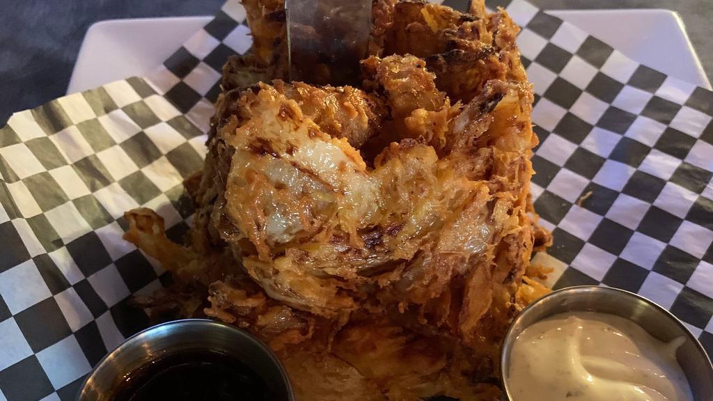 Onion Ring Loaf · Sweet onions thinly sliced and hand battered. Served with BBQ and Ranch dressing.