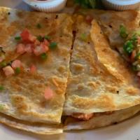 Fajita Quesadilla · A grilled flour tortilla stuffed with cheese, grilled chicken, sautéed peppers and onions. S...