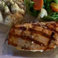 Fresh Northwest Salmon · Flame broiled Northwest salmon, brushed with lemon dill butter. Served with garlic mashed po...