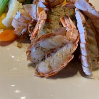 Fire Roasted Jumbo Shrimp · Six U-15 Jumbo shrimp are fire roasted in their split shell and basted with garlic butter. S...