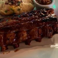 Half Rack Of Baby Back Ribs · Served with BBQ beans and your choice of a twice baked potato, baked potato, french fries or...