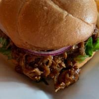 Pulled Pork Sandwich · Fresh pork slow cooked for hours until tender and moist. Hand pulled and slathered in our aw...