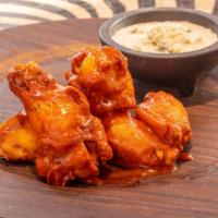 Chicken Wings (10) · Our signature, premium jumbo wings brined overnight, fried and tossed in choice of sauce.