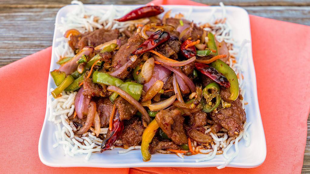 Mongolian Beef · Served spicy. tender sliced beef with bell pepper, onlon, and carrots stir-fried in a spicy mongolian...