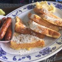 French Toast · 3 slices of texas toast with powdered cinnamon sugar and butter.