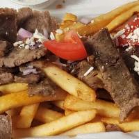 Fully Loaded Fries · Bed of crispy fries, topped with a choice of meat, with tomatoes, red onions and feta. Serve...