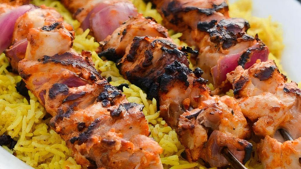 Kabob · With rice. One nine inches wooden skewer of seasoned chicken breast interlaced with fresh red or green bell peppers and onions, grilled to perfection and laid on a bed of lemon rice with a side of tzatziki sauce (Greek yogurt spread).