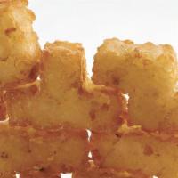 Tater Tots · Lightly seasoned, puzzle-shaped miniature potato patties, served with fry sauce.