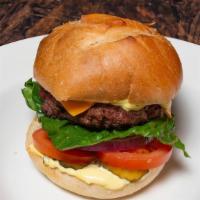 American Burger · House sauce, ketchup, lettuce, onion, pickles, tomatoes, and Cheddar cheese. Served on a fre...