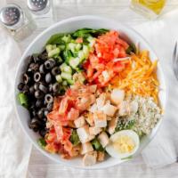 Cobb Salad · Grilled chicken breast, diced smoked bacon, bleu cheese crumbles, tomatoes, cucumbers, olive...