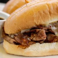 French Dip · Thin sliced hot beef melted Swiss cheese & Au Jus on warm fresh-baked French bread.