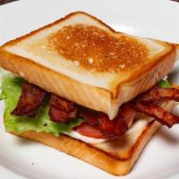 Classic Blt · Six slices of applewood smoked bacon, crisp romaine lettuce, Roma tomatoes, and mayo on ligh...