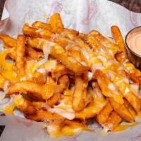 Cheese Fries · Our beloved seasoned fries, covered in real cheddar jack cheese. Melted to perfection and se...