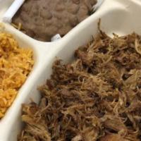 Plato De Carnitas (Plate) · Rice, beans, and tortillas.