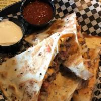 Quesadilla · Stuffed with melted cheese, Baja sauce & pico. Salsa & sour cream on side