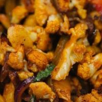 Roasted Cauliflower (Gf) · Roasted cauliflower with sautéed onions and bell peppers, tossed in a Indo-Chinese sweet and...