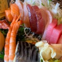 Sashimi Combo · 2 slices of every fish that we have.  18 pieces total, served with seaweed salad and sunomon...