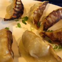 Gyoza Yaki · Popular item. Tender, crisp cabbage and pork dumplings, spiked with ginger, soy sauce and mi...