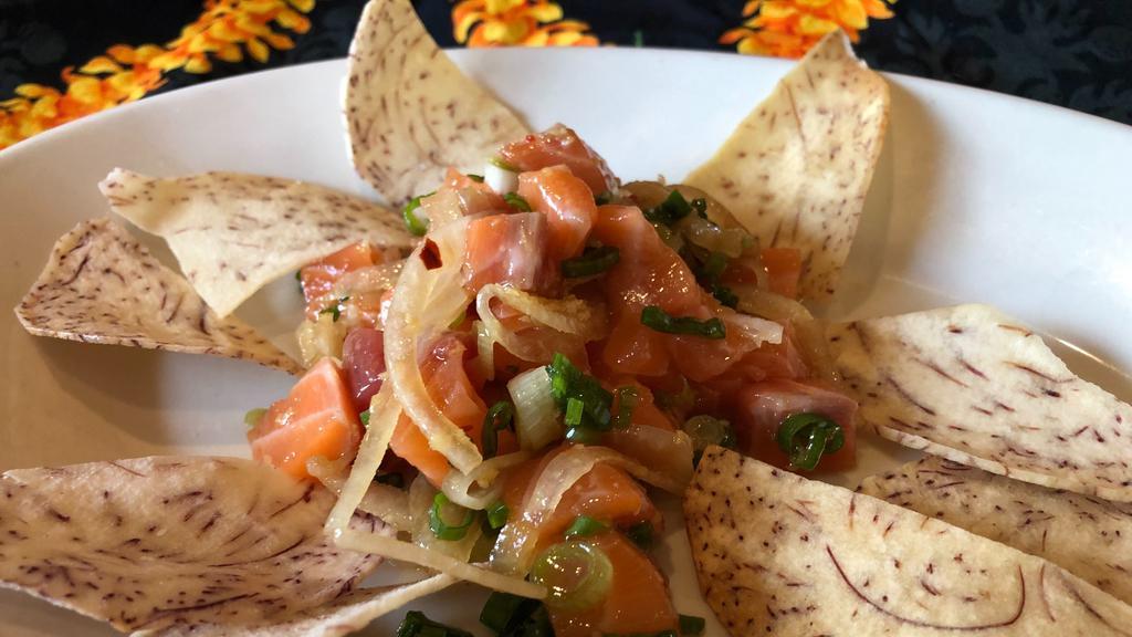 Hawaiian Style Poke · Cubed fresh tuna, salmon and sliced onions tossed with sesame oil, shoyu, red pepper flakes and green onions. Served with homemade taro chips.