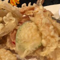 Tempura Sampler · 3 traditional Japanese tempura prawns, assorted vegetables and served with a tempura sauce.