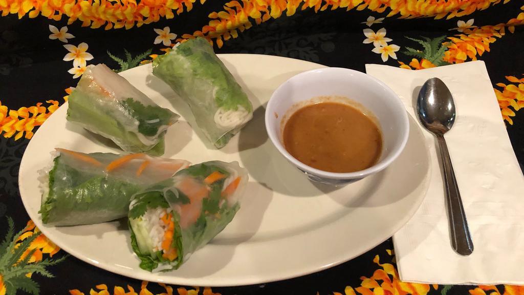Fresh Veggie Spring Rolls · 2 rice flour wrap filled with somen noodles, shredded carrots, cilantro and lettuce served with a Thai peanut sauce.