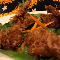 Oh So Ono Coconut Prawns · 4 prawns, citrus marinated then dusted with sweet coconut flakes and fried. Served with a sw...