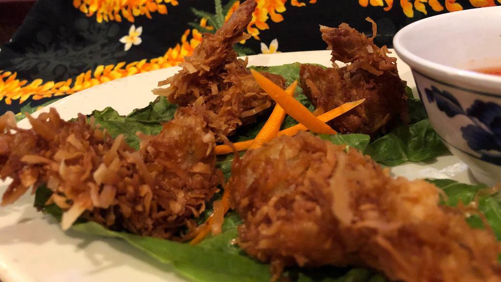 Oh So Ono Coconut Prawns · 4 prawns, citrus marinated then dusted with sweet coconut flakes and fried. Served with a sweet chili sauce.
