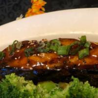 Salmon · Fresh salmon teriyaki lightly seasoned and grilled to perfection. Served with miso soup, ric...