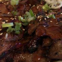 Beef Teriyaki · Tender grilled steak marinated in teriyaki sauce. Served with miso soup, rice, and broccoli.