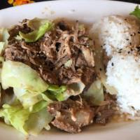 Kalua Pork · Slow roasted Lu'au pork served with cabbage, steamed rice and a side of our homemade Potato/...