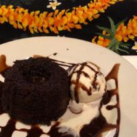 Chocolate Molten Lava Cake · Rich chocolate pudding in a dark chocolate cake, served with a scoop of vanilla ice cream.