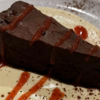 Chocolate Torte · flourless chocolate cake over zabaglione freddo with strawberry sauce served on the side