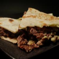 Quesadillas · A flour tortilla with cheese, any type of meat you want, and the sides.