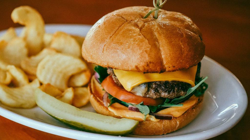 Cheeseburger · 6 oz Patty with Choice of Cheddar, Pepper Jack, Bleu Cheese, Swiss or Vegan Cheese.   Served with choice of side.
