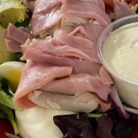 Cobb Salad · Choice of chicken or turkey and ham. Bacon bits, blue cheese crumbles, hard-boiled egg, baby...