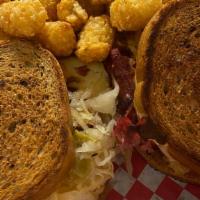 Reuben Sandwich · Shaved pastrami and corned beef with sauerkraut, white American cheese, drizzled with 1000 i...