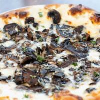 Truffle Shuffle · mushrooms, fresh thyme, cream sauce, parmesean and fontina cheeses finished with a truffle s...