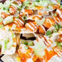 Buffalo Hot Nacho · Popcorn chicken breast tossed in buffalo hot sauce, white queso, ranch dressing, celery & gr...