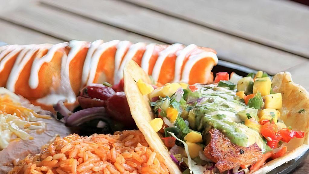 Seafood Combo · Lobster & crab enchilada and signature fish taco.  Served with Mexican rice and refried beans.