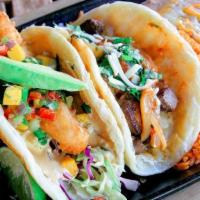 Surf & Turf Taco Combo · Beer battered lobster taco and grilled filet mignon taco. Served with Mexican rice & refried...