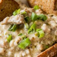 Gravy Toast · Two pieces of white, wheat, or sourdough toast topped with sausage gravy.